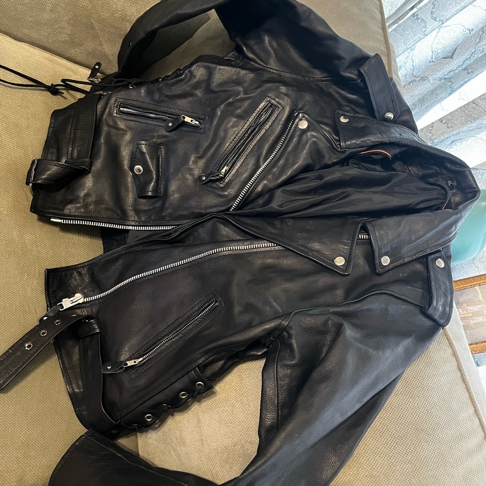 Unspecified brand, XL (faux?) leather jacket. Very punk.